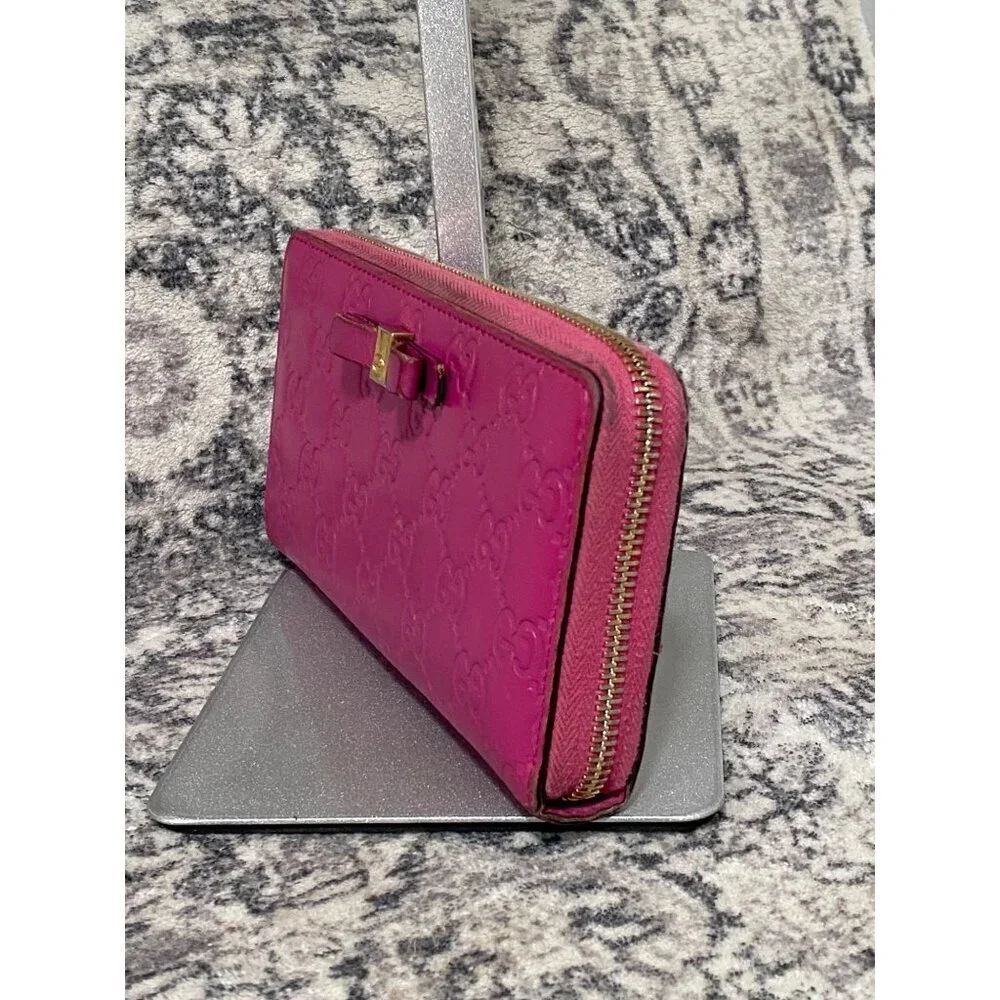 Gucci Guccissima Bow Zip Around Long Wallet in Fuschia